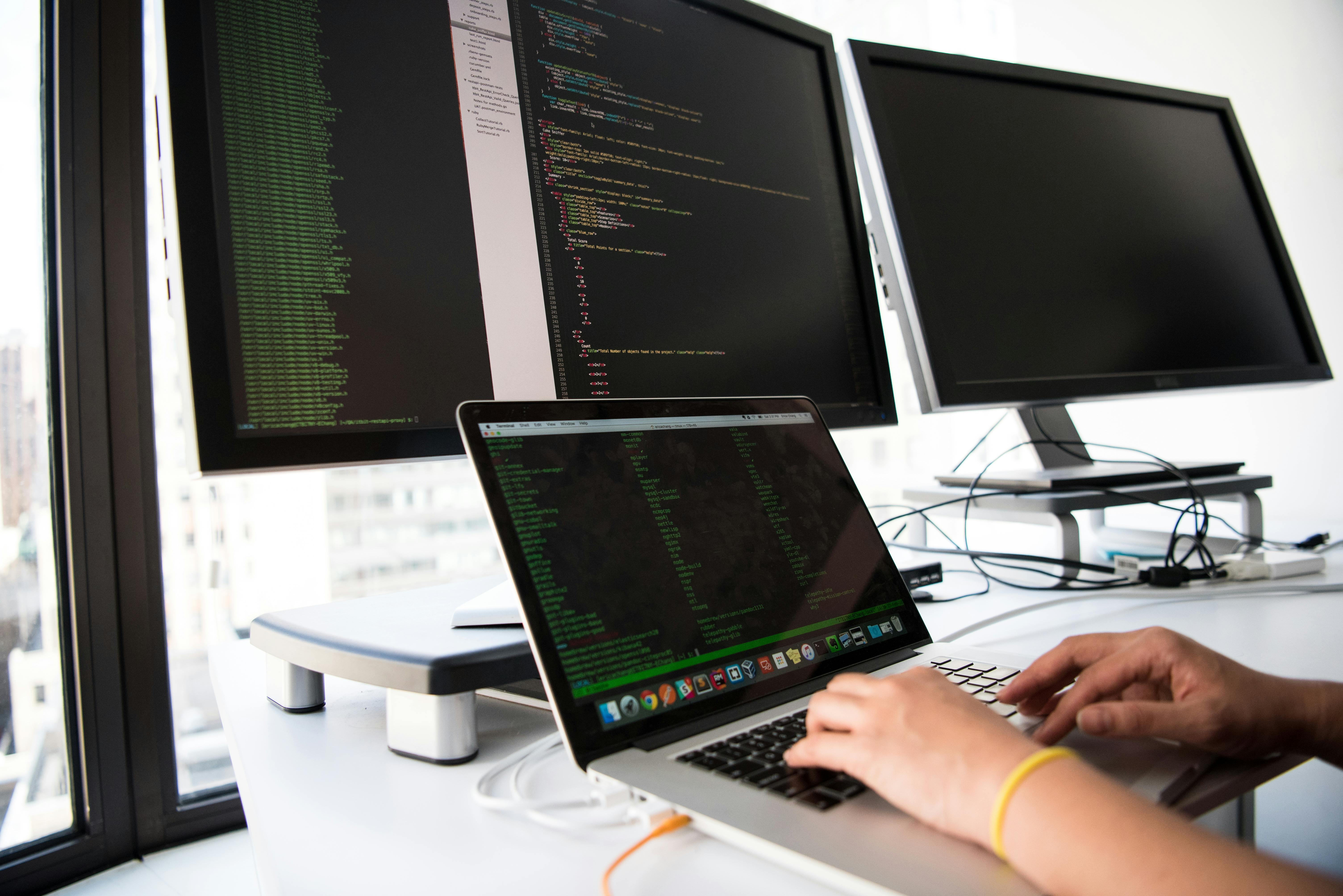 Modern web design workspace with computers and creative elements